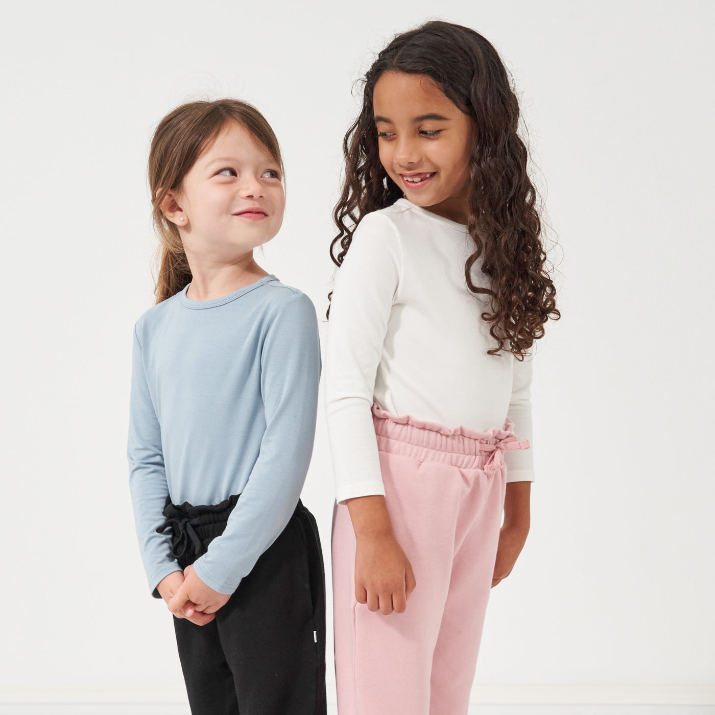Image of two children wearing Classic Tees and Paperbag Joggers from Play by Little Sleepies