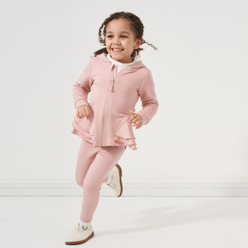 Click to see full screen - Child running wearing a Mauve Blush peplum hoodie paired with matching Mauve Blush leggings