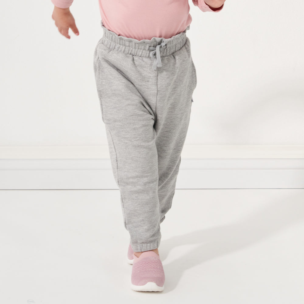 Child running towards the camera wearing Heather Gray paperbag joggers