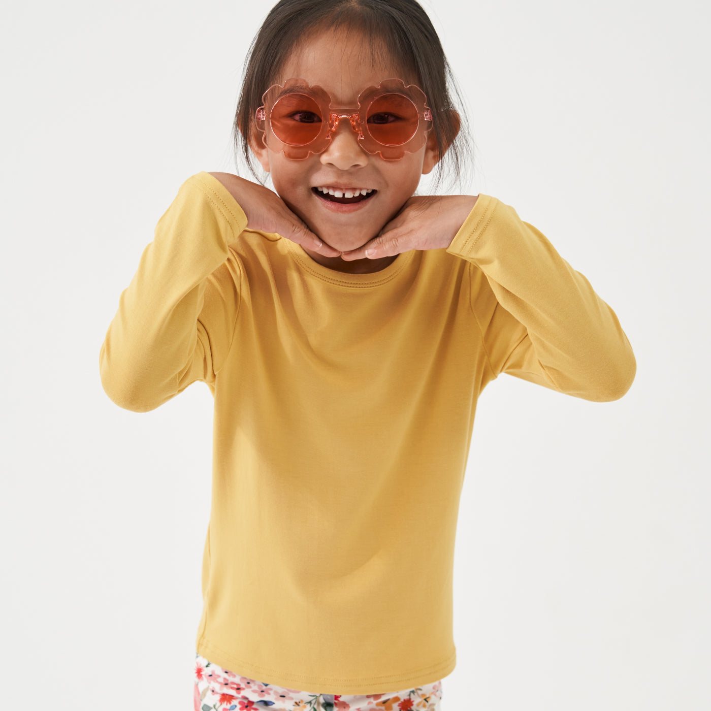 Child with sunglasses on wearing a Honey classic tee