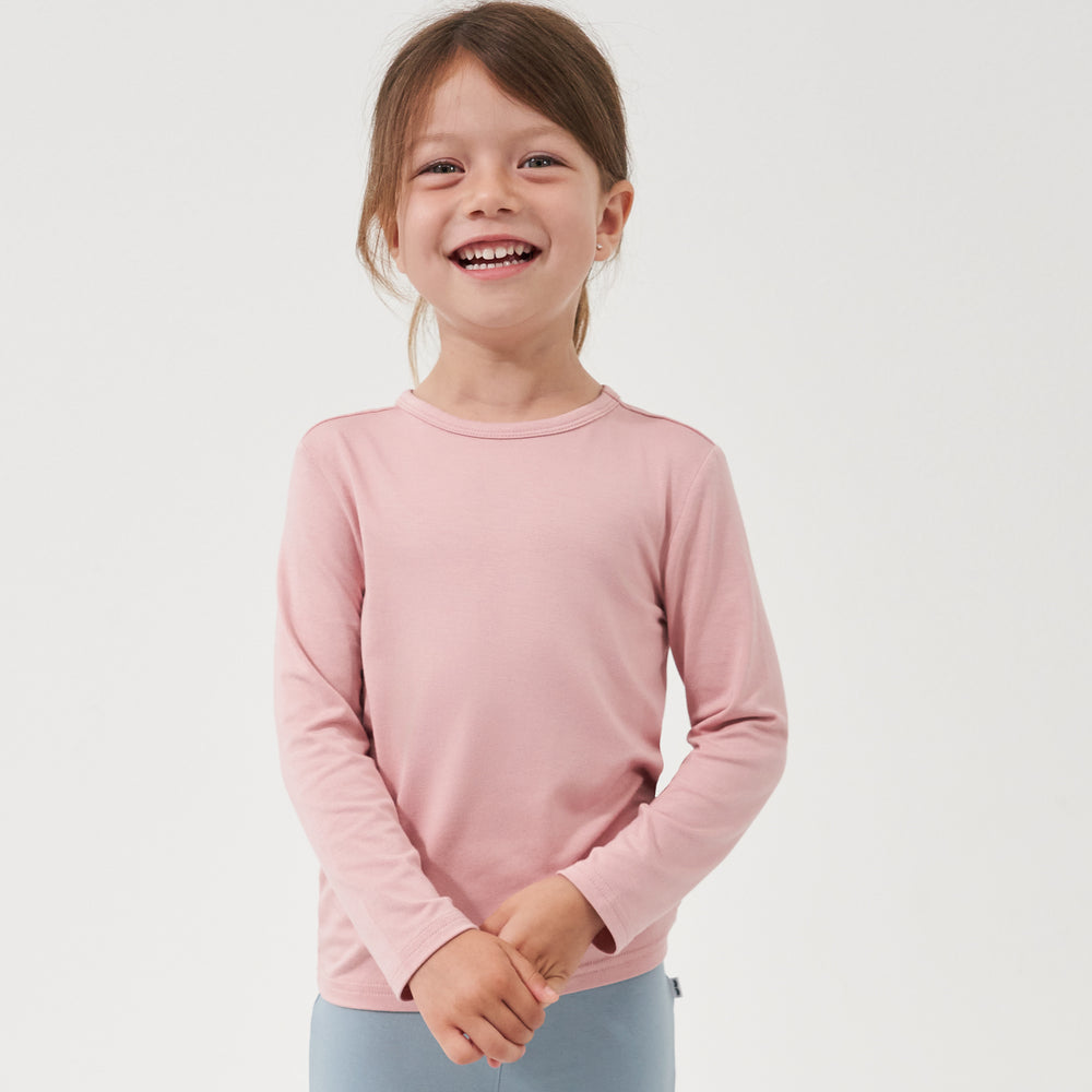 Child wearing a Mauve Blush classic tee paired with Fog leggings