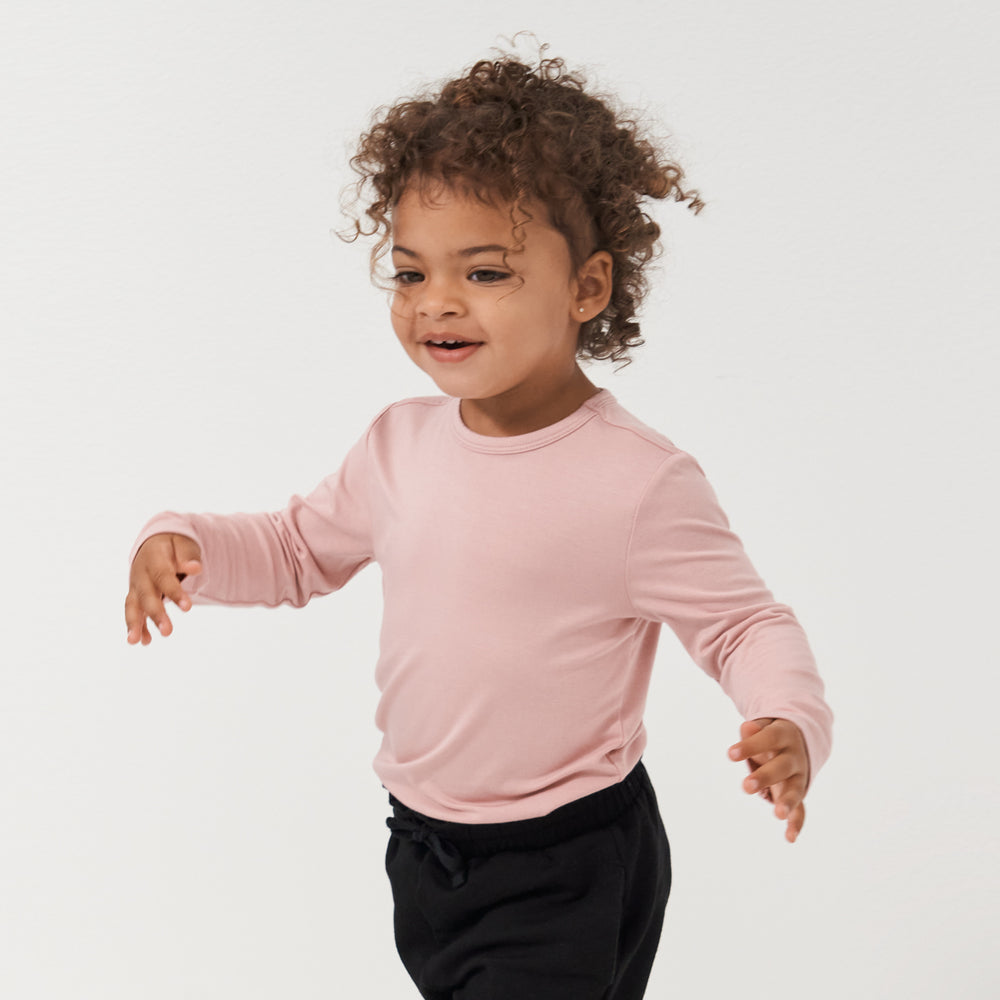 Child wearing a Mauve Blush classic tee paired with Black paperbag joggers