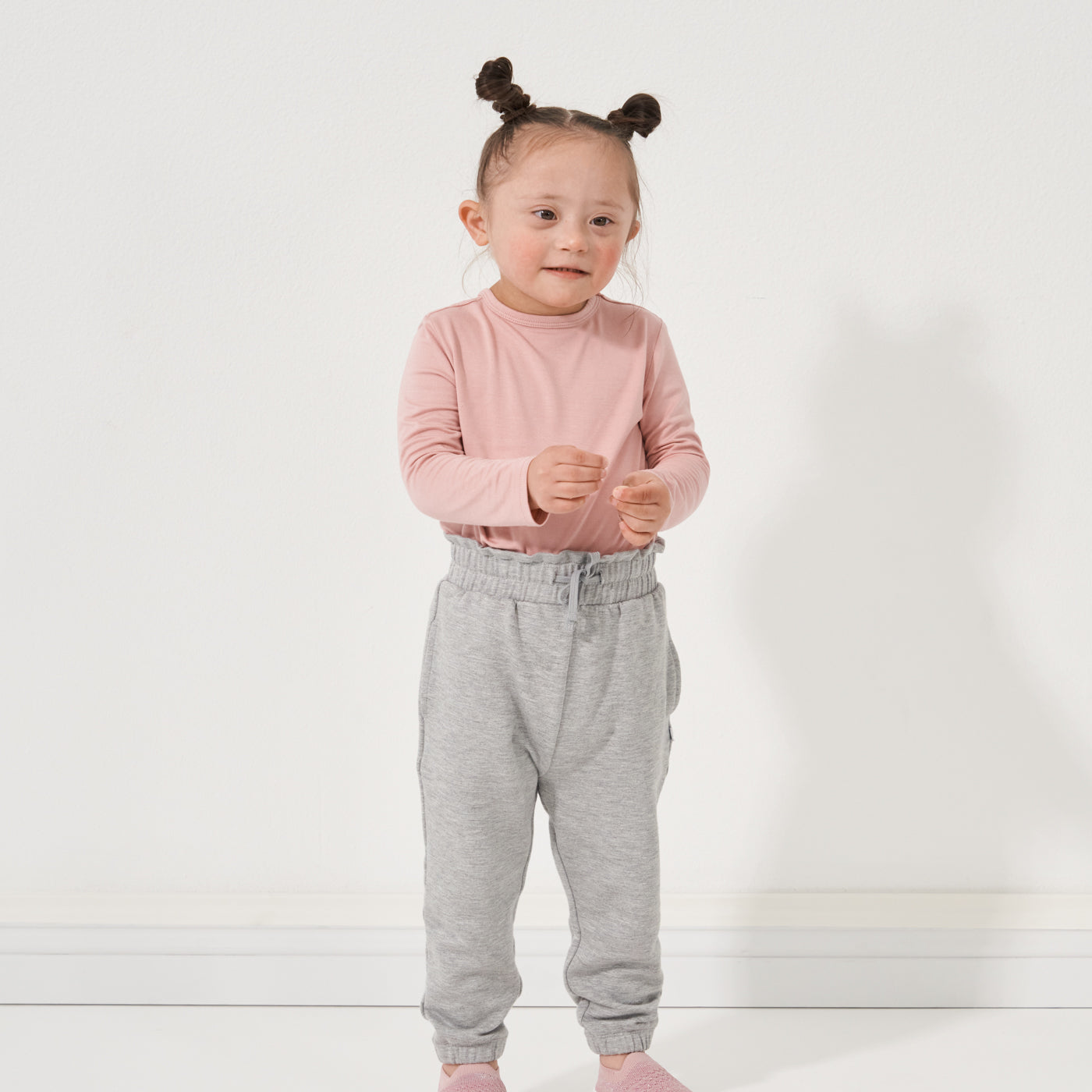 Child wearing a Mauve Blush classic tee paired with Heather Gray paperbag joggers