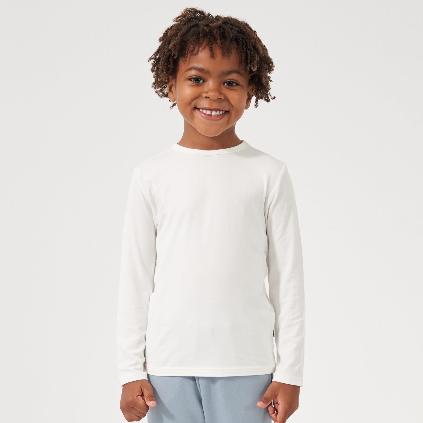 Child wearing an Ivory classic tee paired with Fog joggers