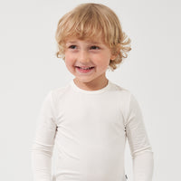 Child wearing an Ivory classic tee
