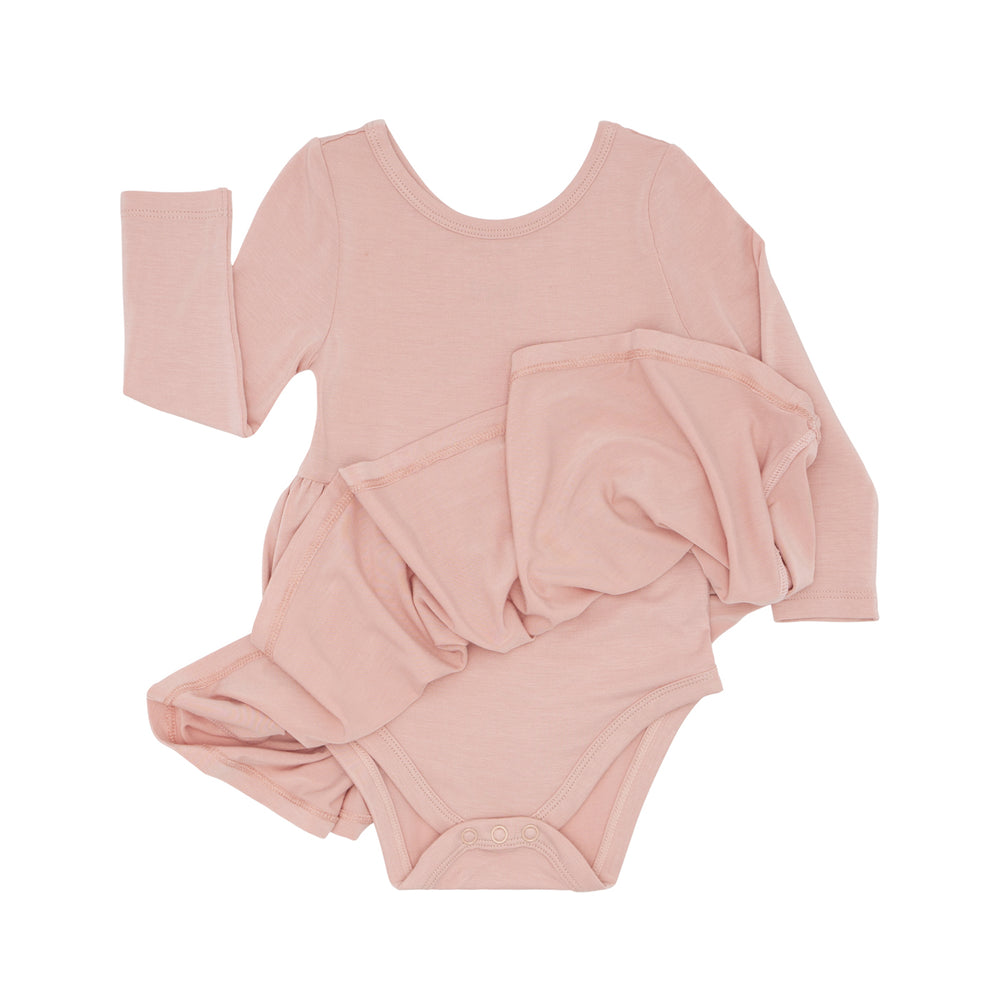 Flat lay image of a Mauve Blush twirl dress with bodysuit showing off the bodysuit