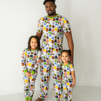 Family of three wearing matching Legends of the Galaxy pajamas