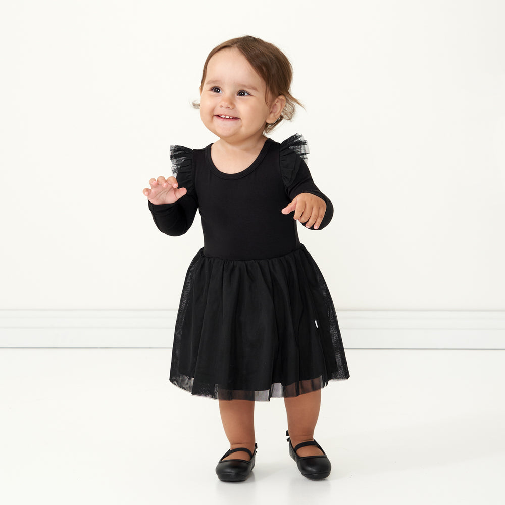 Child wearing a Black flutter tutu dress with bloomer