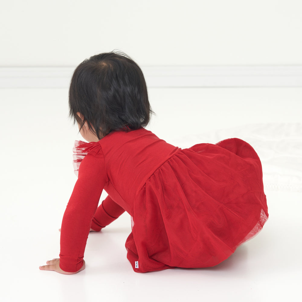 Child crawling wearing a Holiday Red flutter tutu dress with bloomer