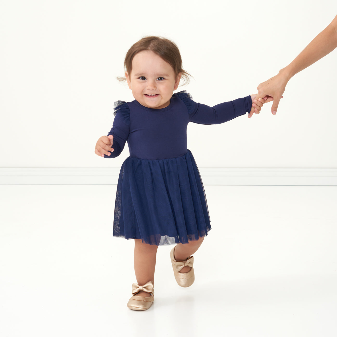 Child wearing a Classic Navy flutter tutu dress with bloomer