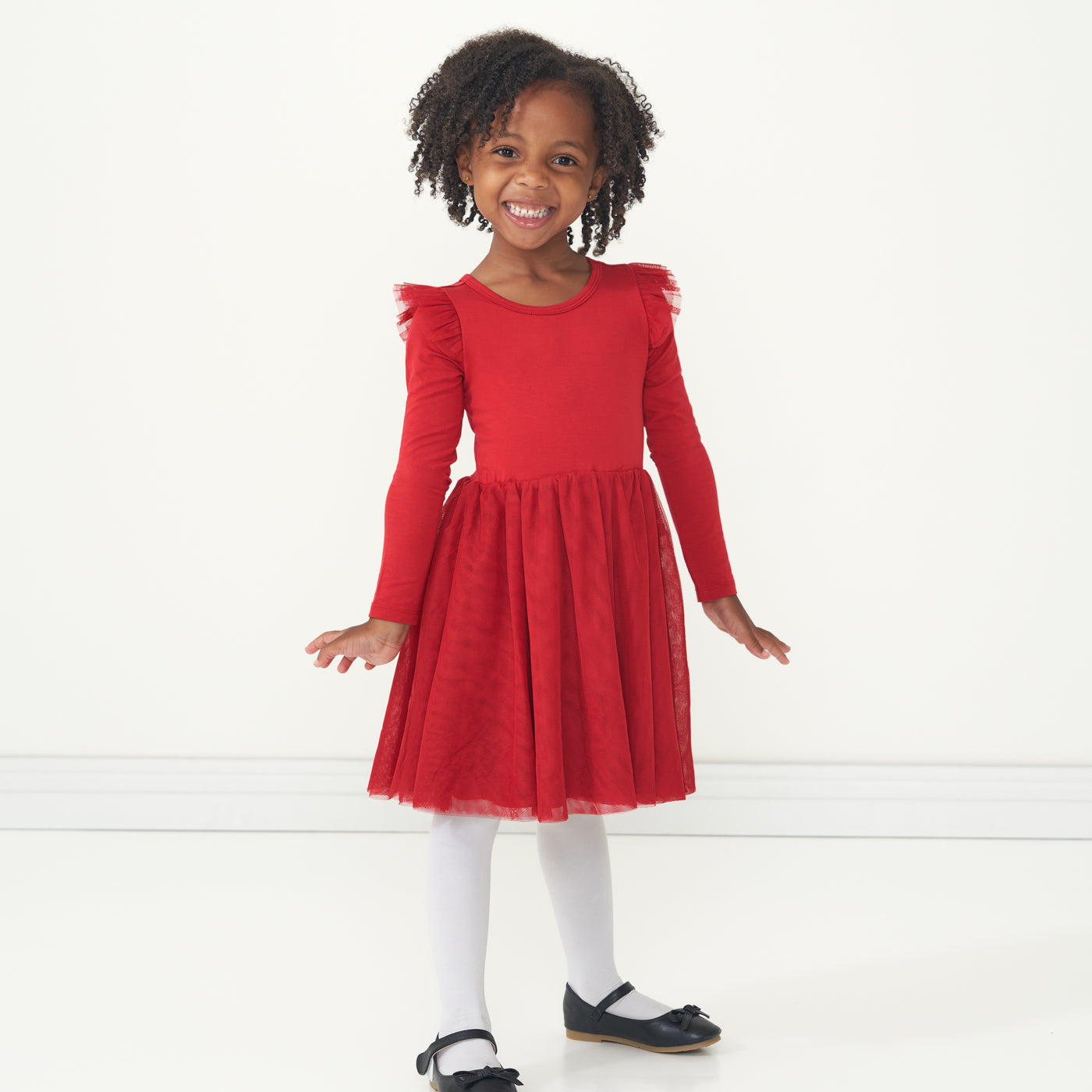 Child wearing a Holiday Red flutter tutu dress