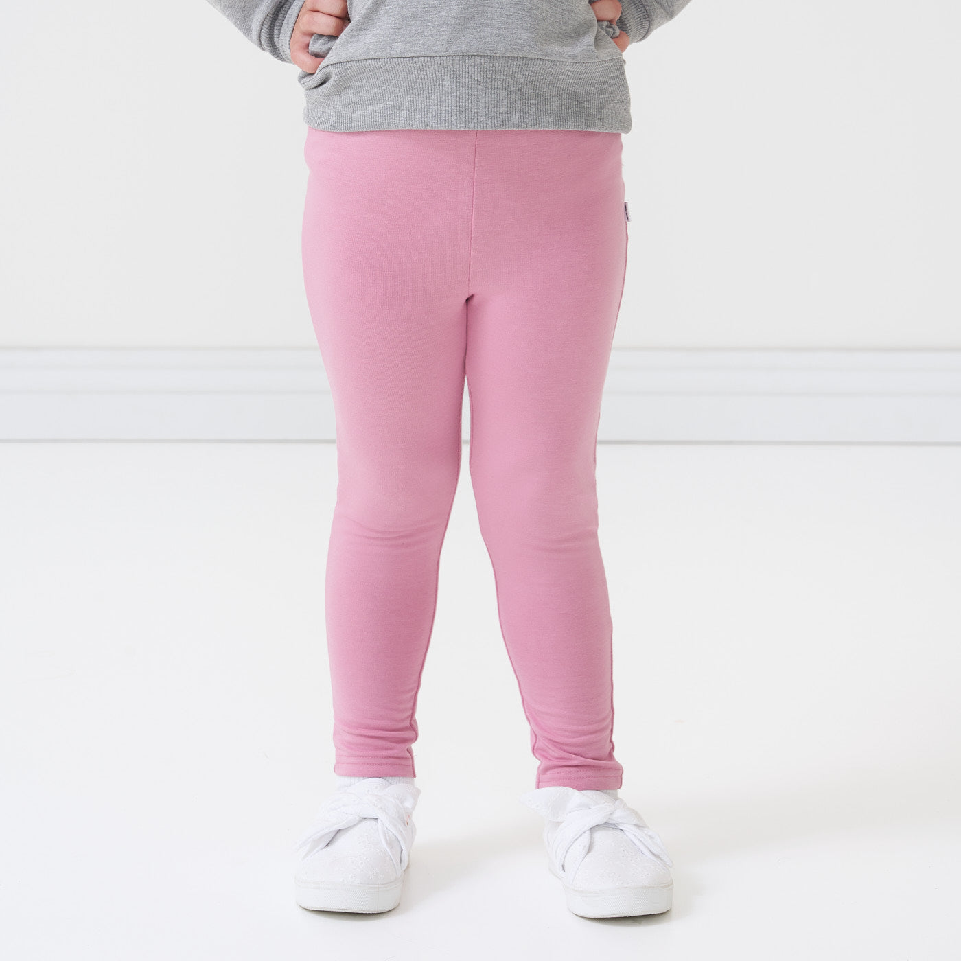 Close up image of a child wearing Garden Rose Cozy Leggings