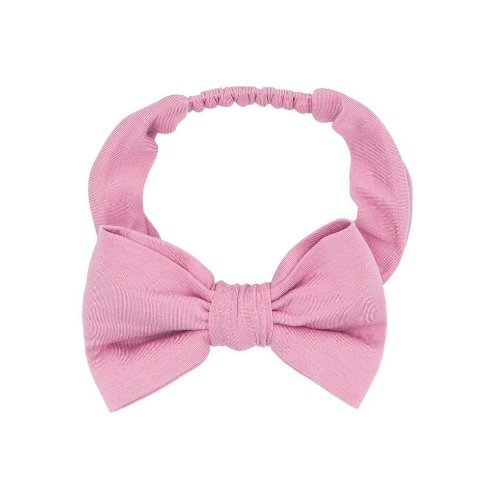 Flat lay image of a Garden Rose luxe bow headband size age 4 to age 8