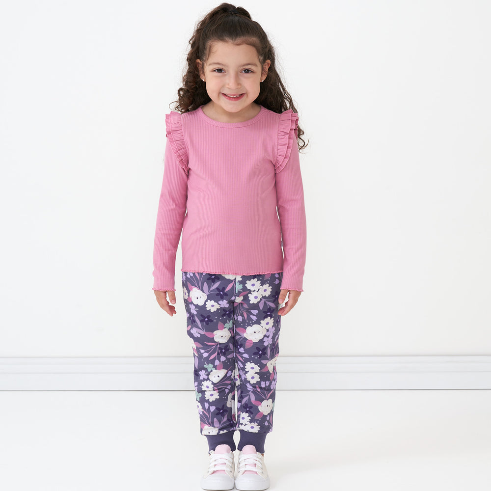 Child wearing a Garden Rose ribbed flutter tee paired with Sugar Plum Floral leggings
