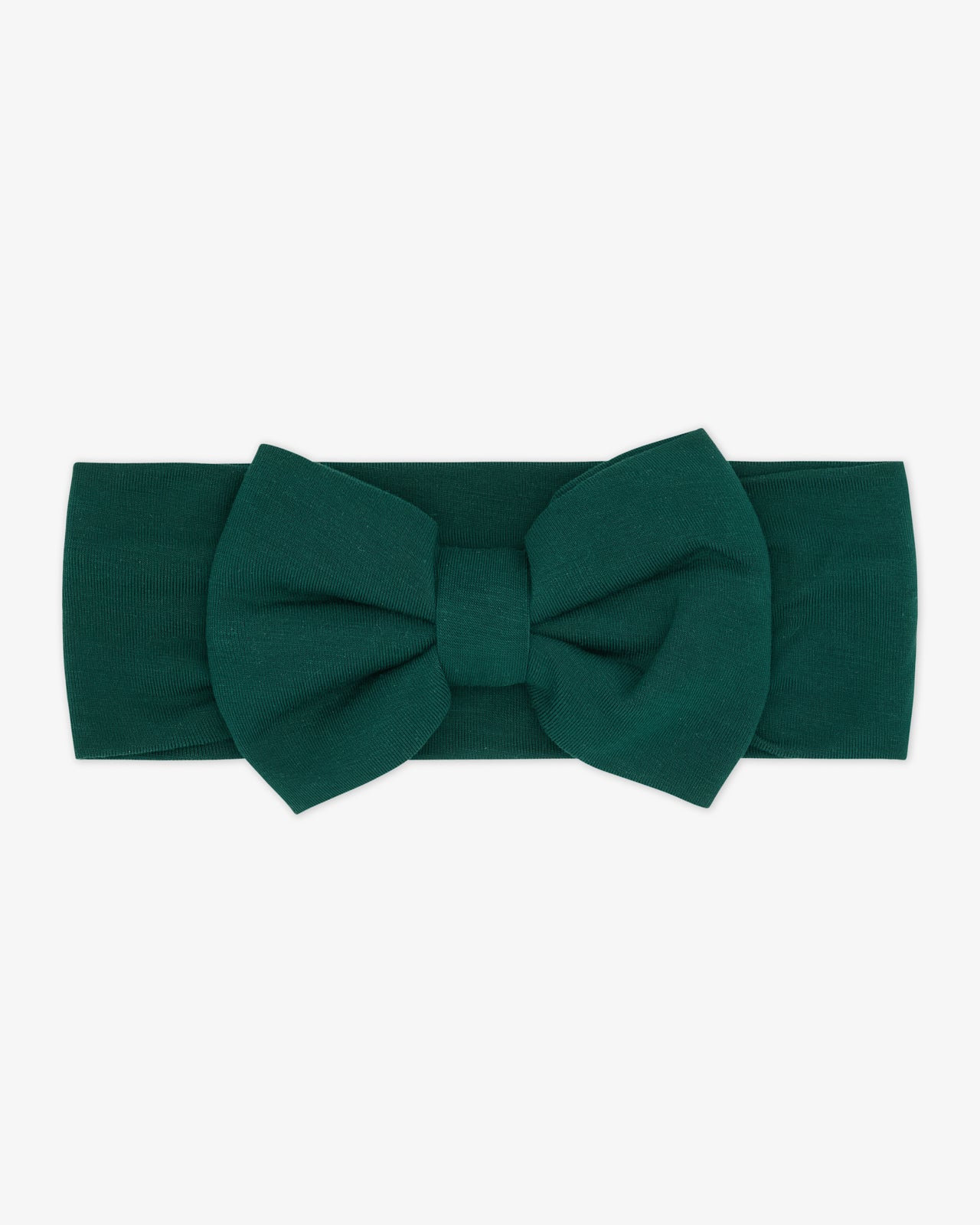 Flat lay of the Emerald Luxe Bow Headband