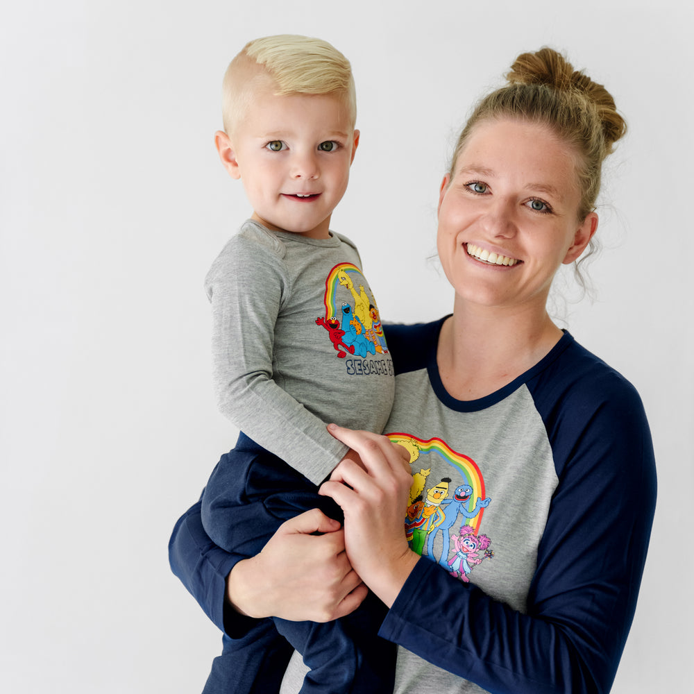 Close up image of a mother and child wearing Spelling with Sesame Street raglan tees