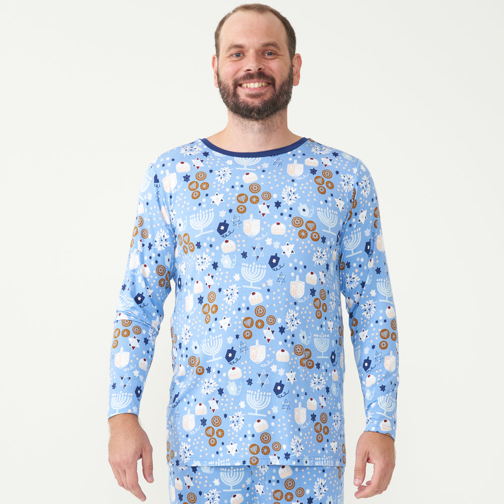 man wearing a men's Hanukkah Lights and Love pajama top