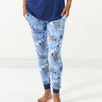 Close up image of a woman wearing Hanukkah Lights and Love women's pajama bottoms paired with a women's Sapphire short sleeve pajama top