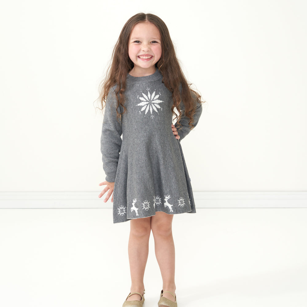 Alternate image of a child posing wearing a Heather Charcoal Snowflake Sweater Dress
