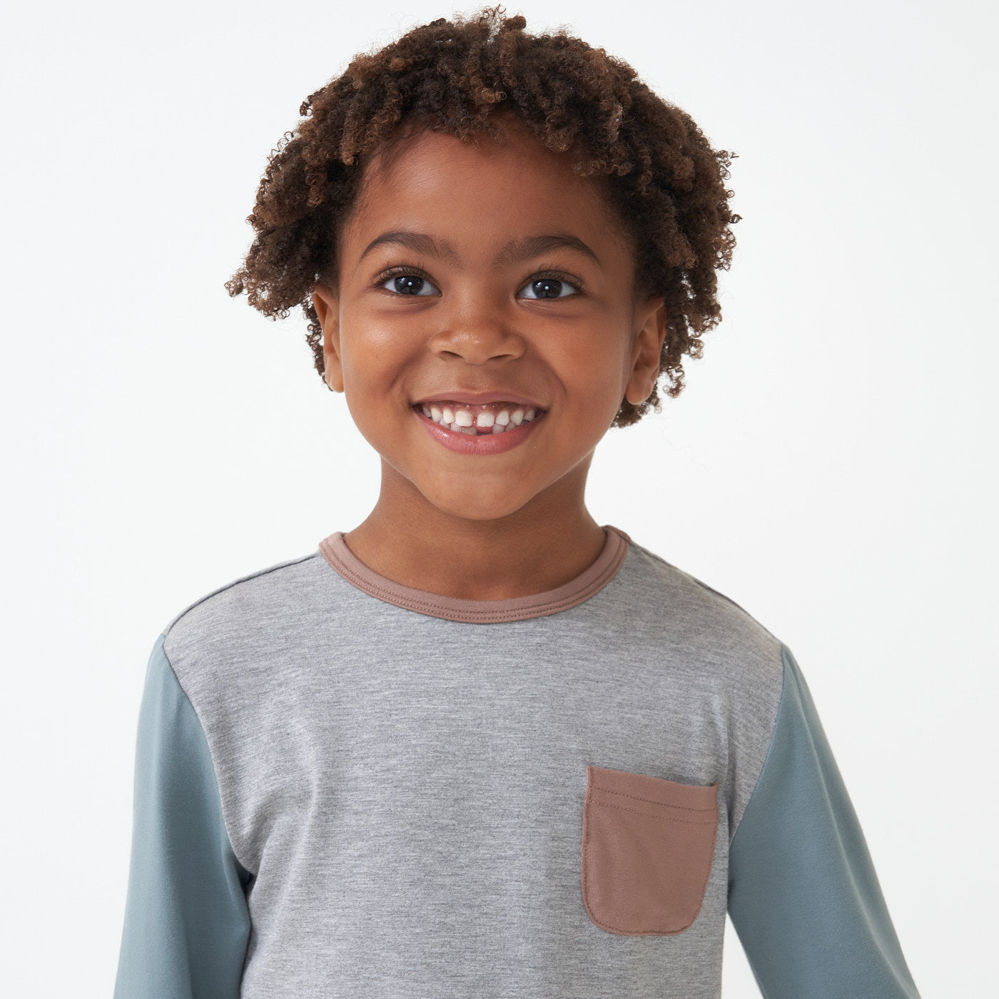 Close up image of a child wearing a Colorblock Pocket tee detailing the pocket