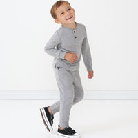Child wearing a Heather Gray henley tee paired with Heather Gray joggers