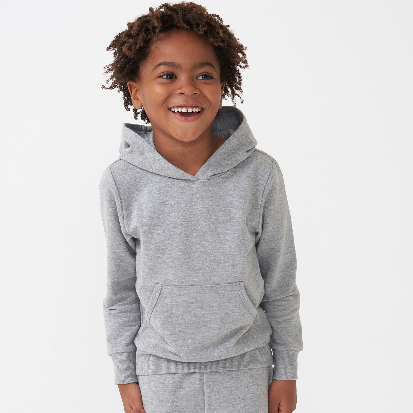 Child posing wearing a Heather Gray pullover hoodie