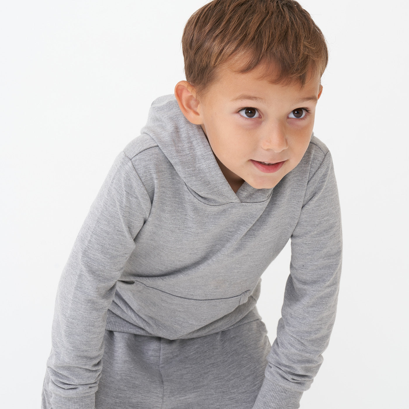 Child wearing a Heather Gray pullover hoodie