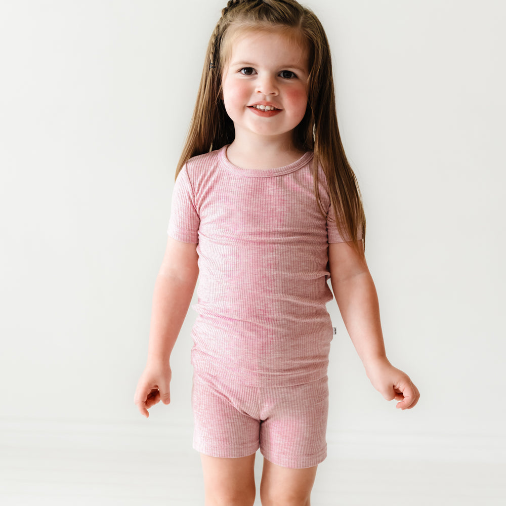 Child wearing Heather Mauve Ribbed two piece short sleeve and shorts pajama set