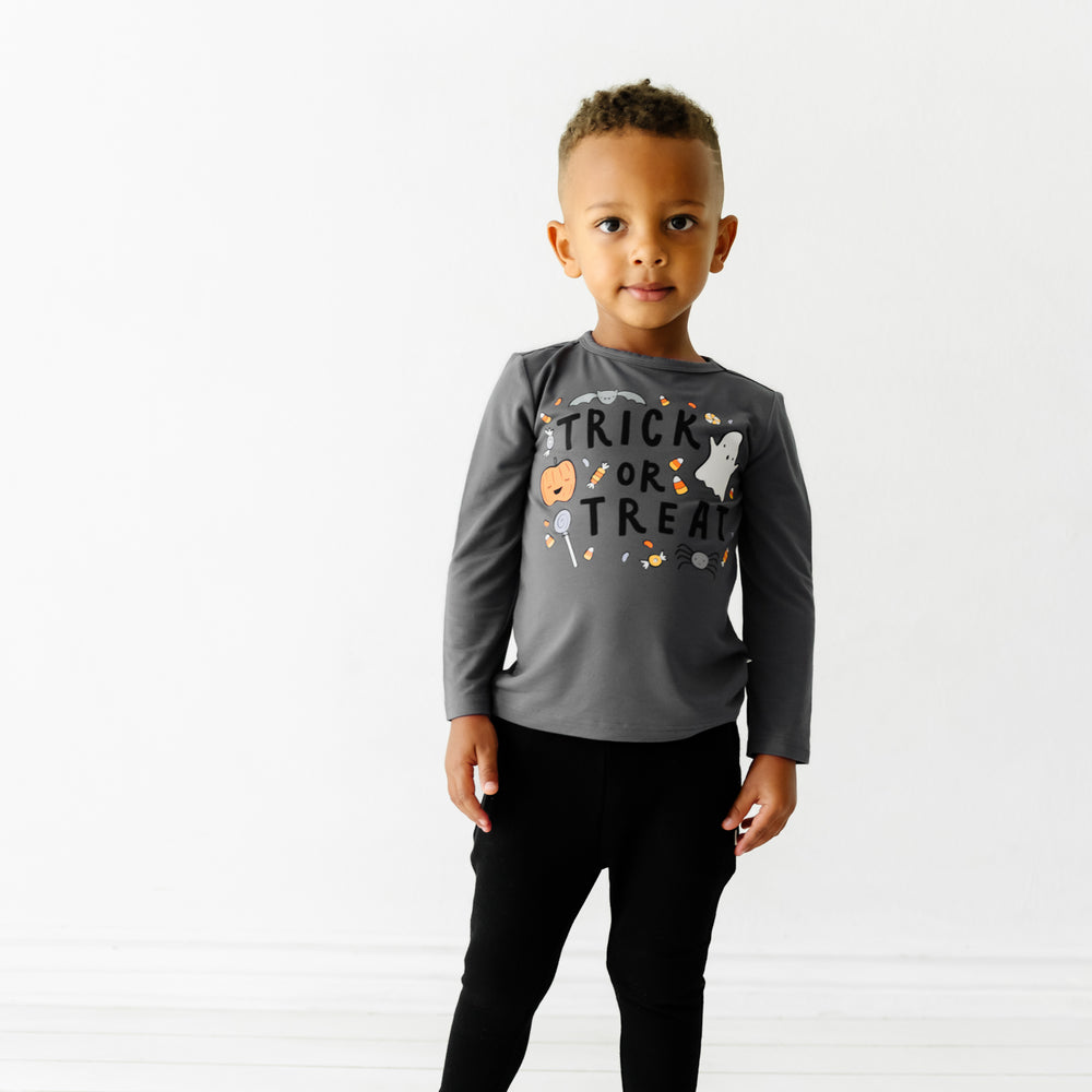 Child wearing a Trick or Treat graphic tee paired with Black Joggers