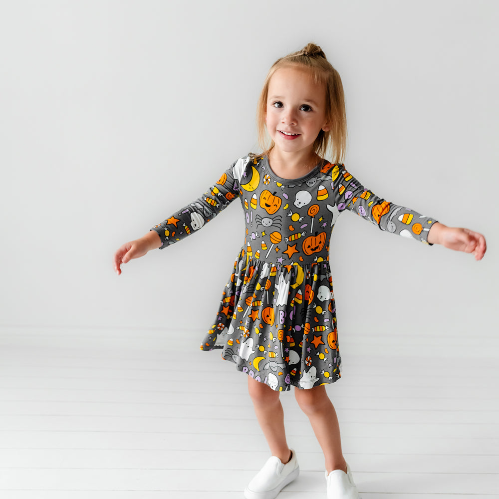 Child wearing a Hey Boo printed twirl dress with bodysuit