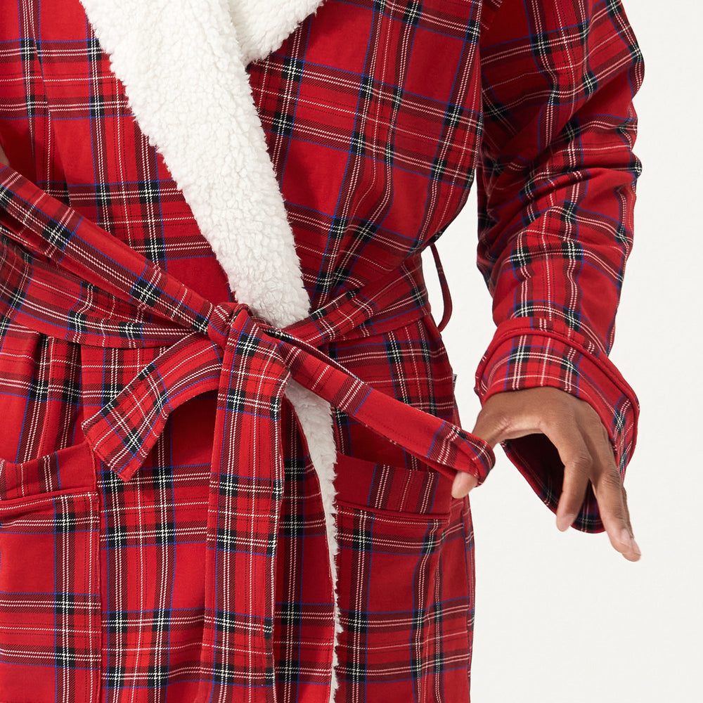 Close up image of a man wearing a Holiday Plaid cozy robe detailing the waistband tie