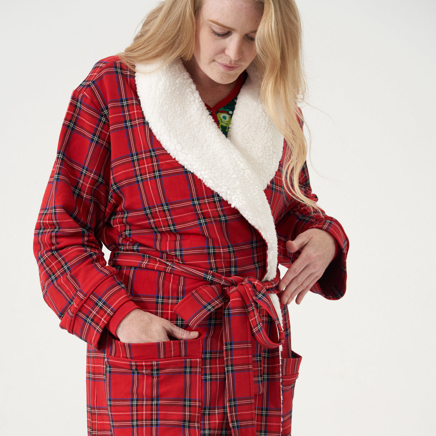 Close up image of a woman wearing a Holiday Plaid cozy robe