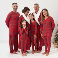 Family wearing matching Holiday Plaid pajamas