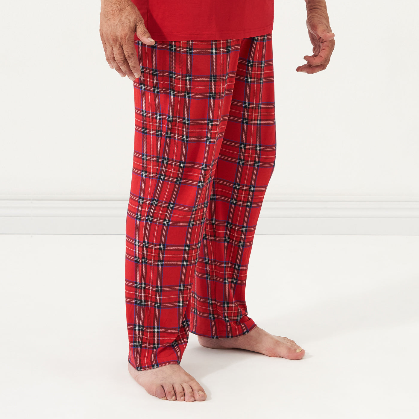 Close up image of a man wearing Holiday Plaid men's pajama pants
