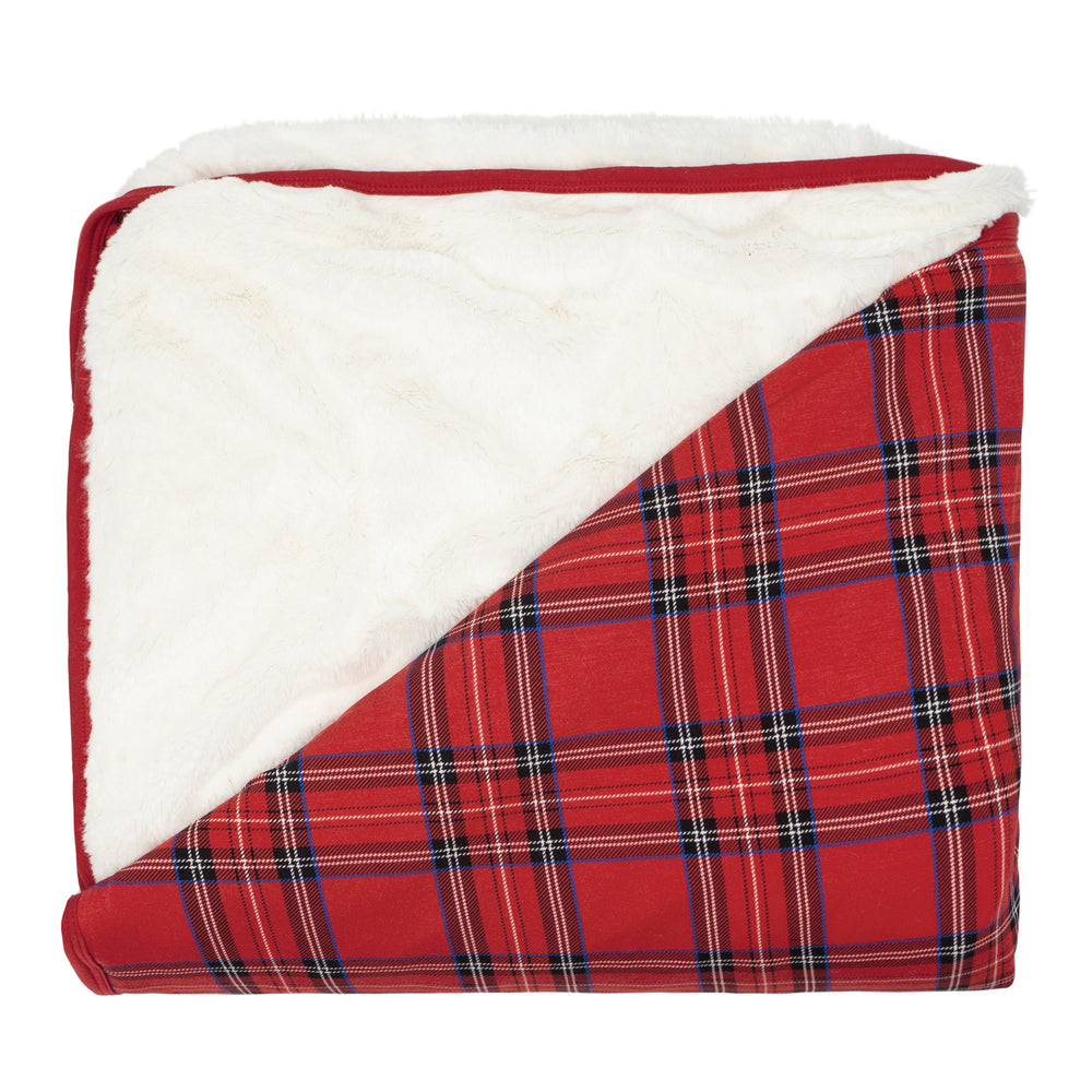 Flat lay image of a Holiday Plaid plush oversized cloud blanket