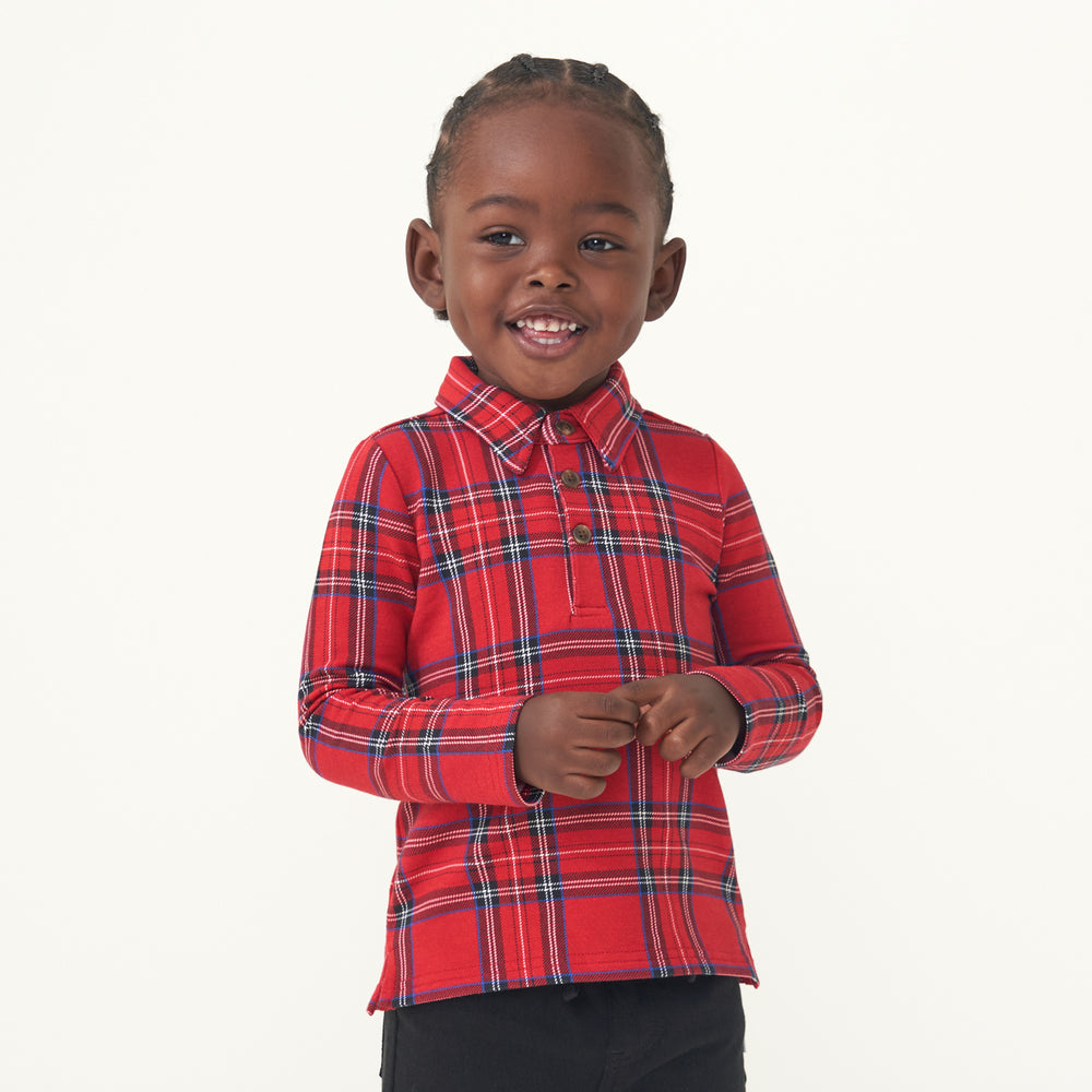 Child wearing a Holiday Plaid polo shirt