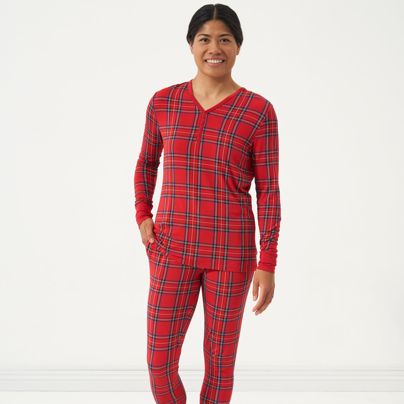 Woman wearing a Holiday Plaid women's pajama top and matching pants