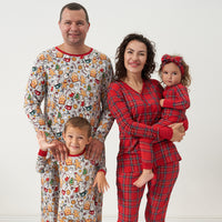 Family wearing coordinating holiday pajamas