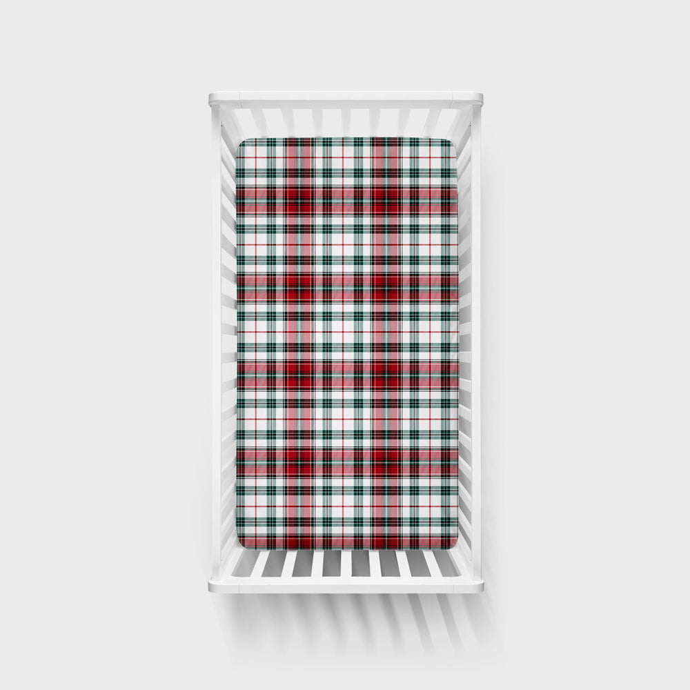 Overhead view of the Holly Plaid Fitted Crib Sheet