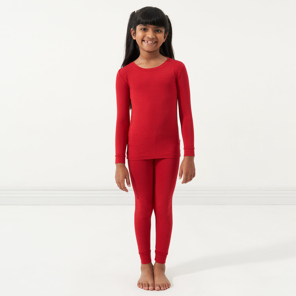 Child wearing a Holiday Red two-piece pajama set