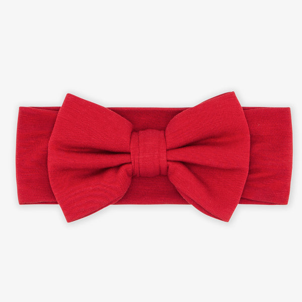 Flat lay image of the Holiday Red Luxe Bow Headband