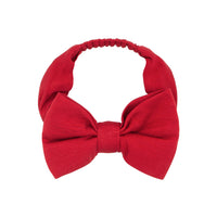 Alternate flat lay image of a Holiday Red luxe bow headband
