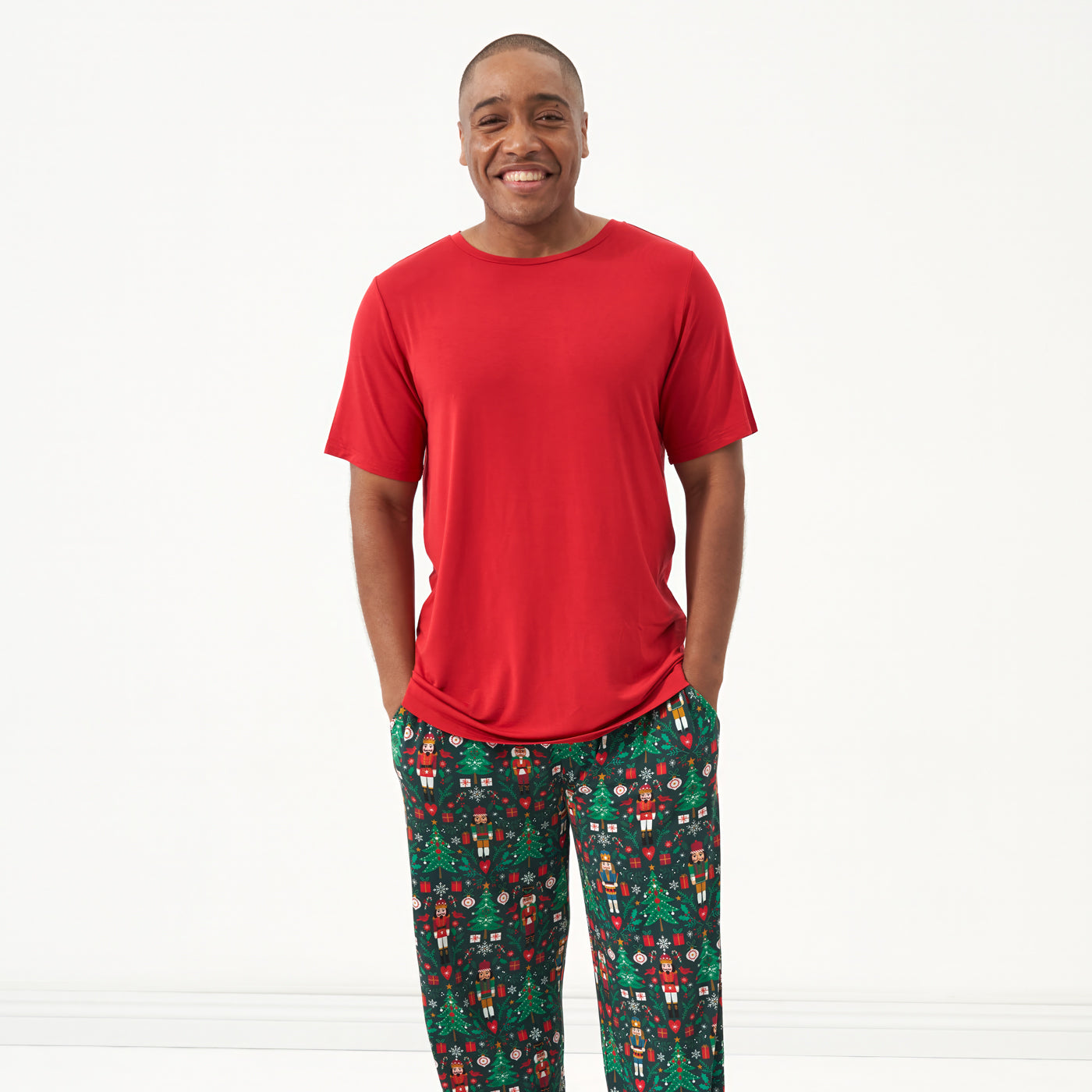 Man wearing a Holiday Red men's short sleeve pajama top and coordinating holiday pajama pants