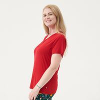 Side view image of a woman wearing a Holiday Red women's short sleeve pajama top