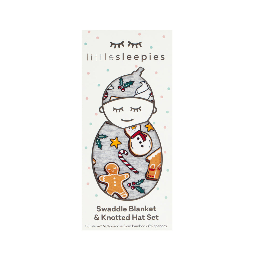Image of a Holiday Treats swaddle and hat set in Little Sleepies peek a boo packaging