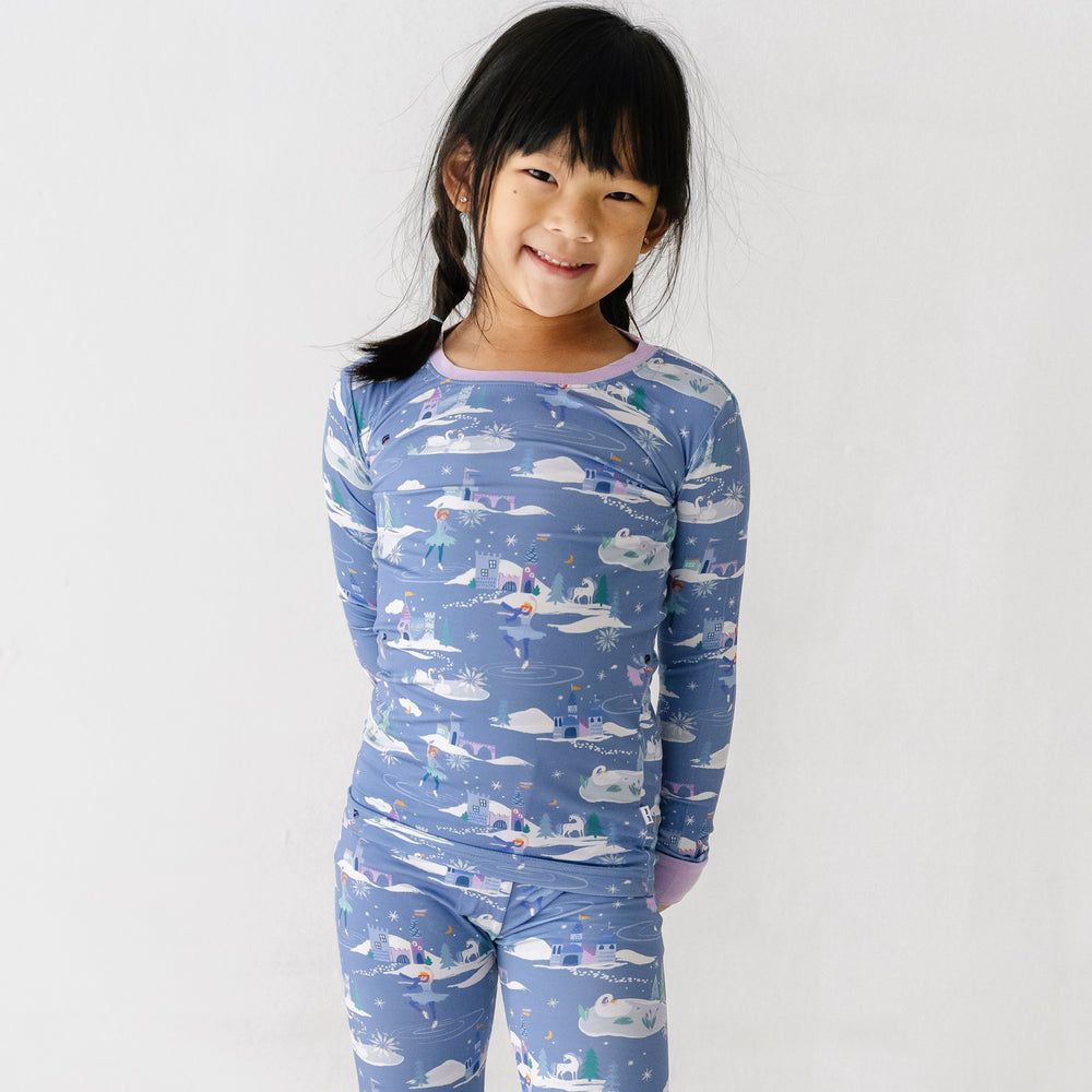 Close up image of a child posing wearing an Ice Princess printed two piece pajama set