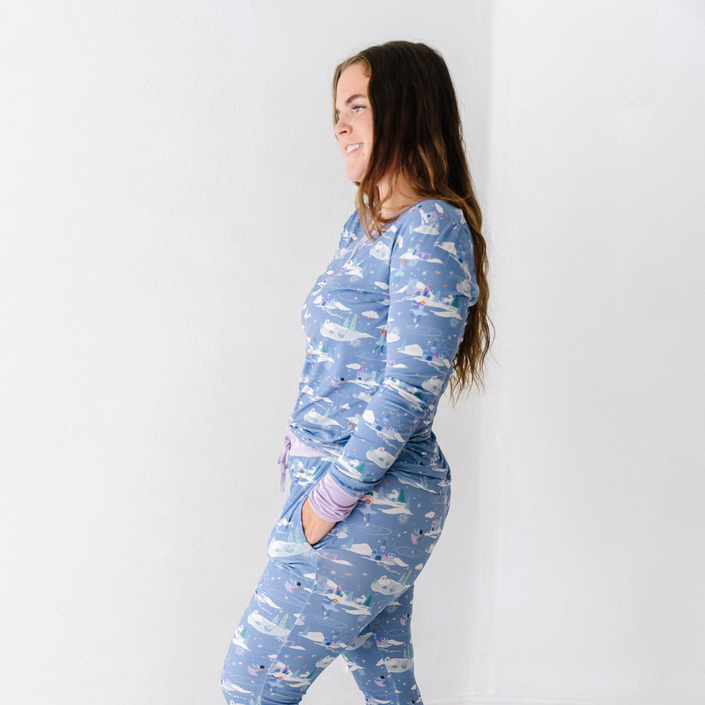 Profile view of a woman wearing an Ice Princess women's pajama top paired with matching women's pajama pants