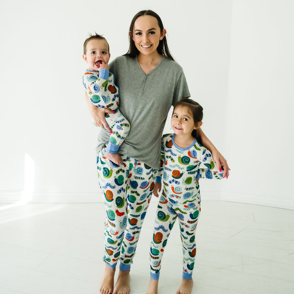 Mother and two children wearing matching Inchin' Along pajamas