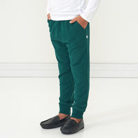 Close up image of a child wearing Emerald Joggers showing the pocket detailing