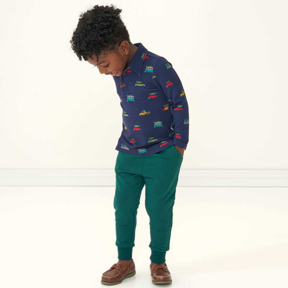 Child wearing Emerald Joggers paired with a Tree Traffic printed polo